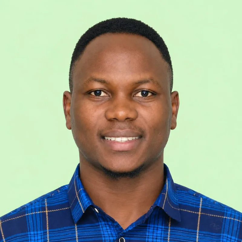 Portrait of Stephen Yachim Nwati, Founder and CEO, smiling in a blue checked shirt